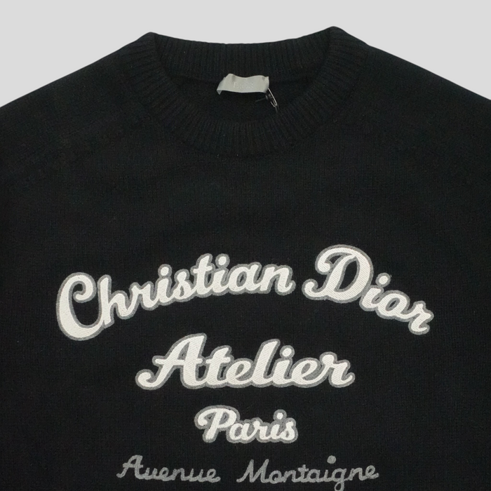 CLB XXIII black virgin wool sweater featuring white Christian Dior Atelier embroidery on the chest