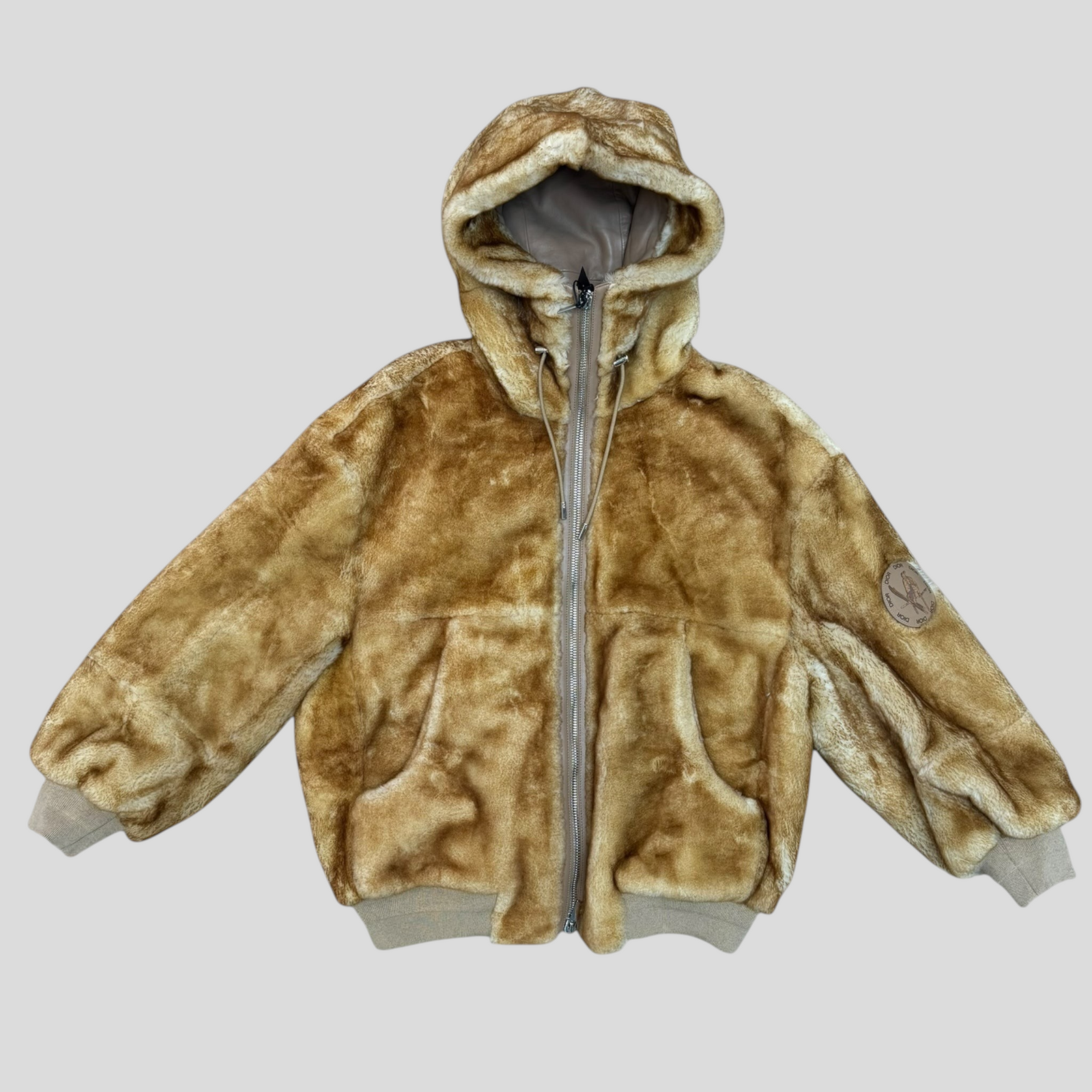 CLB XXIII Dior lamb fur hooded coat in tan with a front zipper closure and ribbed cuffs