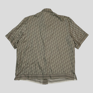 CLB XXIII Dior Oblique green silk button-up shirt featuring the iconic monogram pattern and striped hem detail