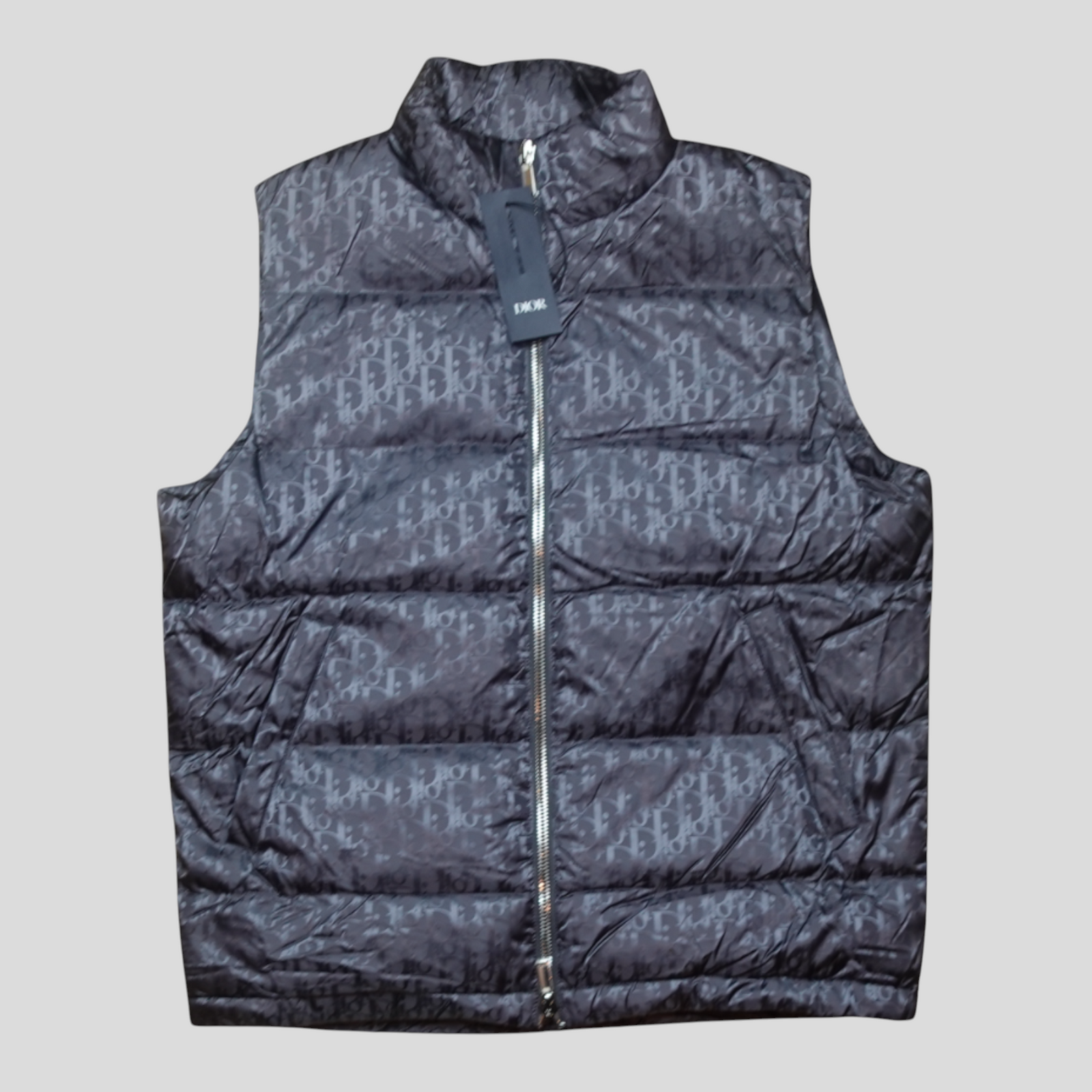 CLB XXIII grey Dior Oblique padded vest jacket with full zip closure and brand tag attached