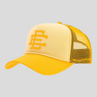 CLB XXIII Eric Emanuel trucker hat in light yellow with a mesh back and bold EE logo on the front panel