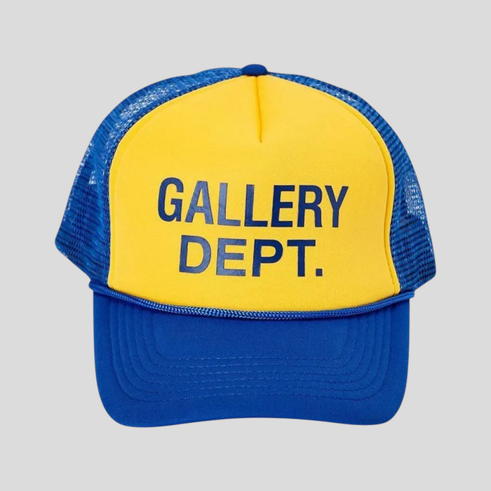 CLB XXIII GALLERY DEPT. trucker hat in blue and yellow with a mesh back and bold front logo print.