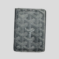 CLB XXIII pre-owned grey Goyard Saint Marc cardholder featuring the iconic chevron print and visible signs of wear.