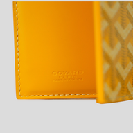 CLB XXIII Goyard Saint-Pierre card wallet in bright yellow leather with embossed logo and white contrast stitching
