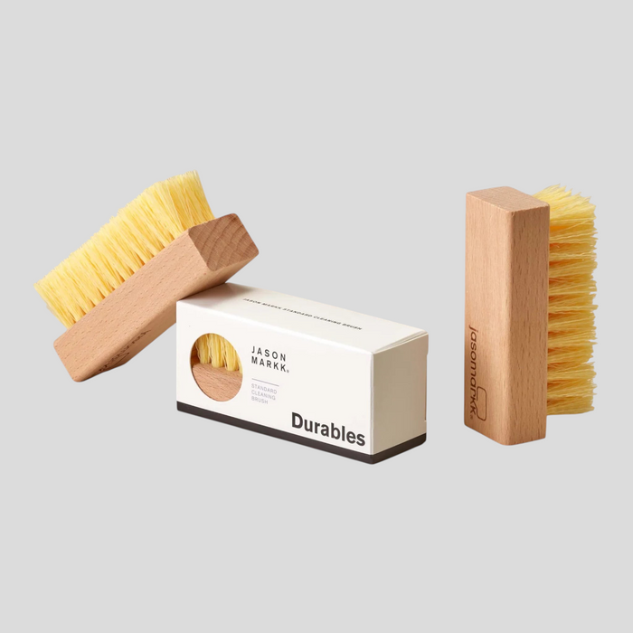CLB XXIII Jason Markk standard cleaning brush with synthetic bristles and wood handle next to its product box
