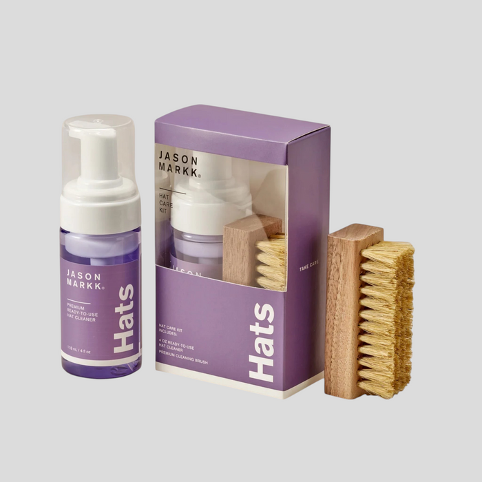 CLB XXIII Jason Markk Hat Care Kit featuring a purple cleaning solution bottle, box packaging, and wooden brush