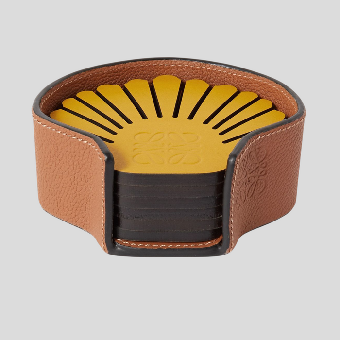 CLB XXIII Loewe seashell-shaped leather coaster set in yellow and black with a tan leather storage case