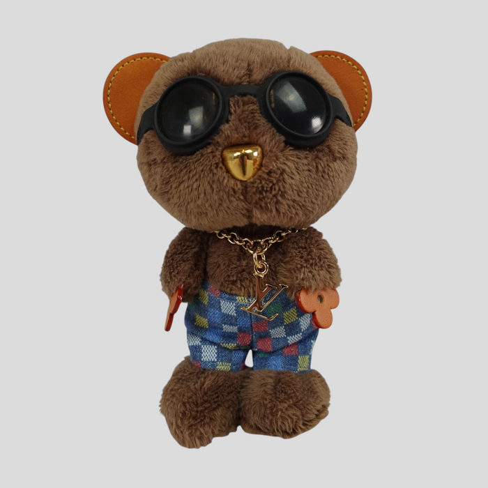 CLB XXIII Louis Vuitton LV bear bag charm in brown plush wearing black sunglasses and checkered shorts with gold chain