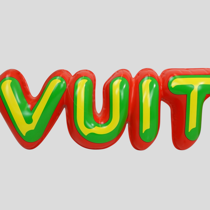 CLB XXIII Louis Vuitton bubble letter store display sign in red, green, and yellow with minor surface scuffs.