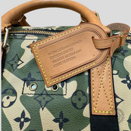 CLB XXIII Louis Vuitton Takashi Murakami Keepall 55 featuring green camo monogram print and tan leather luggage tag