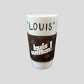 CLB XXIII white ceramic coffee cup with a brown monogram leather sleeve featuring Louis Vuitton branding
