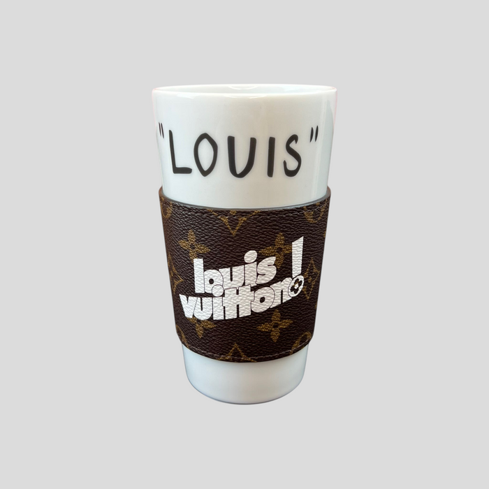 CLB XXIII white ceramic coffee cup with a brown monogram leather sleeve featuring Louis Vuitton branding