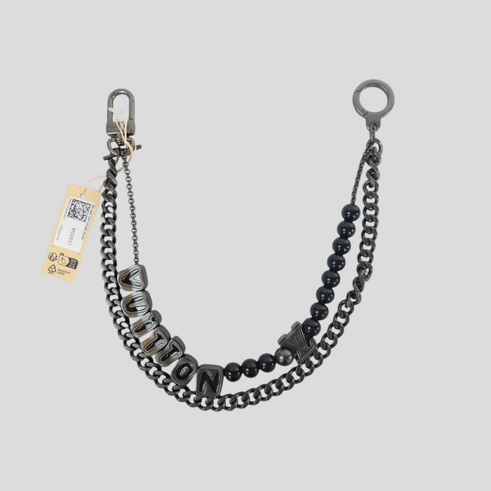 CLB XXIII Louis Vuitton chain belt in dark ruthenium featuring black beads and LV logo charms