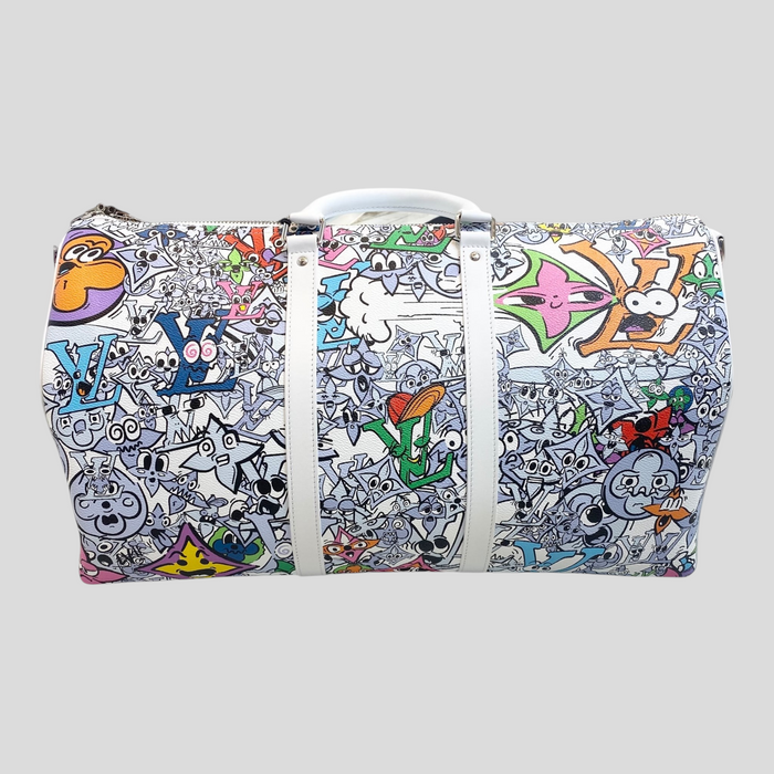 CLB XXIII Louis Vuitton Keepall Bandoulière 50 travel bag featuring a vibrant multi-colored graffiti comics print.