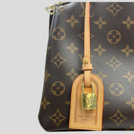CLB XXIII Louis Vuitton Monogram Petit Palais handbag featuring brown coated canvas and a gold padlock luggage tag