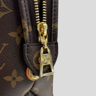 CLB XXIII Louis Vuitton Monogram Petit Palais handbag featuring brown coated canvas and polished gold-tone zipper pull