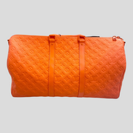 CLB XXIII Louis Vuitton Keepall Bandouliere 50 travel bag in vibrant orange embossed Monogram leather