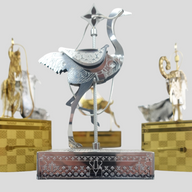 CLB XXIII Louis Vuitton holiday ornament featuring a silver metallic crane on a monogram engraved base
