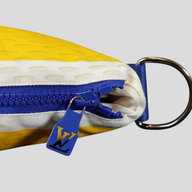 CLB XXIII Louis Vuitton SS26 yellow beach towel bag featuring a blue zipper, LV logo pull, and metal D-ring hardware.