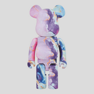 CLB XXIII 1000% Bearbrick Marble collectible figure in a vibrant pink, purple, and blue marbled pattern.