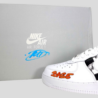 CLB XXIII Matty Boy custom white Nike Air Force 1 Low sneaker with orange BASE text and graphic details