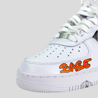 CLB XXIII Matty Boy custom white Air Force 1 sneaker with orange graffiti BASE lettering on the toe box