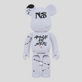 CLB XXIII 1000% Bearbrick Nas x Applebum collectible figure in white with black paint splatter and graphic details.