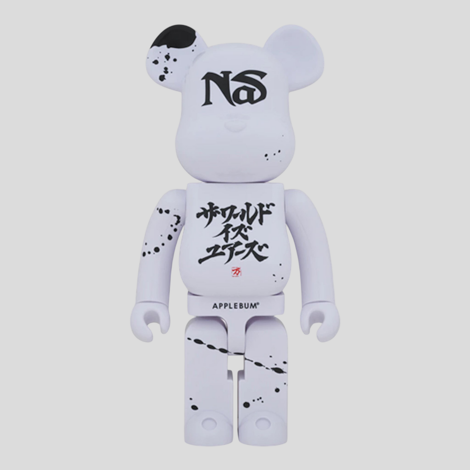 CLB XXIII 1000% Bearbrick Nas x Applebum collectible figure in white with black paint splatter and graphic details.