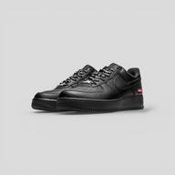 CLB XXIII Nike Air Force 1 Low Supreme sneakers in black leather with red box logo and branded laces
