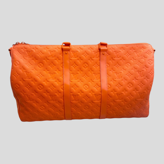 CLB XXIII orange Louis Vuitton Keepall Bandouliere 50 travel bag in embossed Monogram leather with top handles.