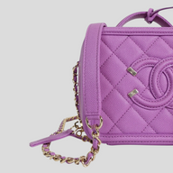 CLB XXIII purple Chanel caviar quilted vanity case with CC logo and gold chain strap detail