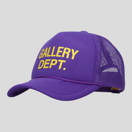 CLB XXIII purple trucker hat featuring yellow GALLERY DEPT. text on the front foam panel and breathable mesh back