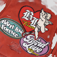 CLB XXIII red Carhartt work jacket featuring distressed fabric and embroidered Blind Love patchwork designs