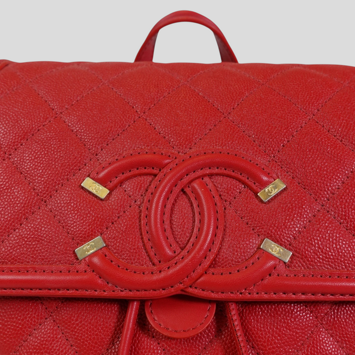 CLB XXIII red Chanel Caviar leather Filigree backpack featuring signature quilted pattern and gold CC logo hardware