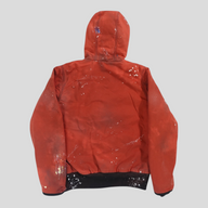 CLB XXIII red patchwork Carhartt work jacket with a distressed paint-splatter finish and black ribbed hem