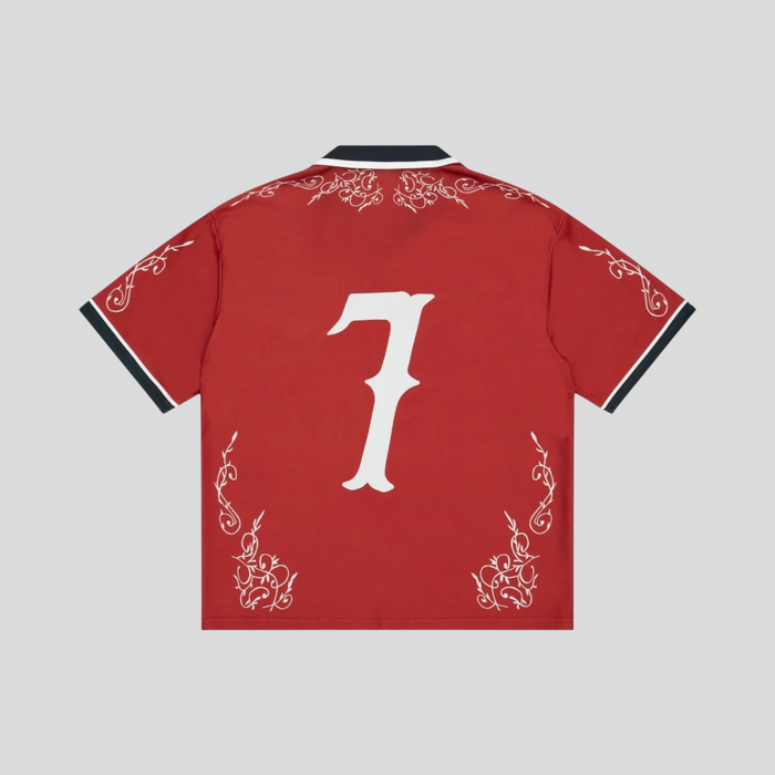 CLB XXIII Bravest Studios red western jersey featuring a white number 7 and intricate white filigree embroidery.