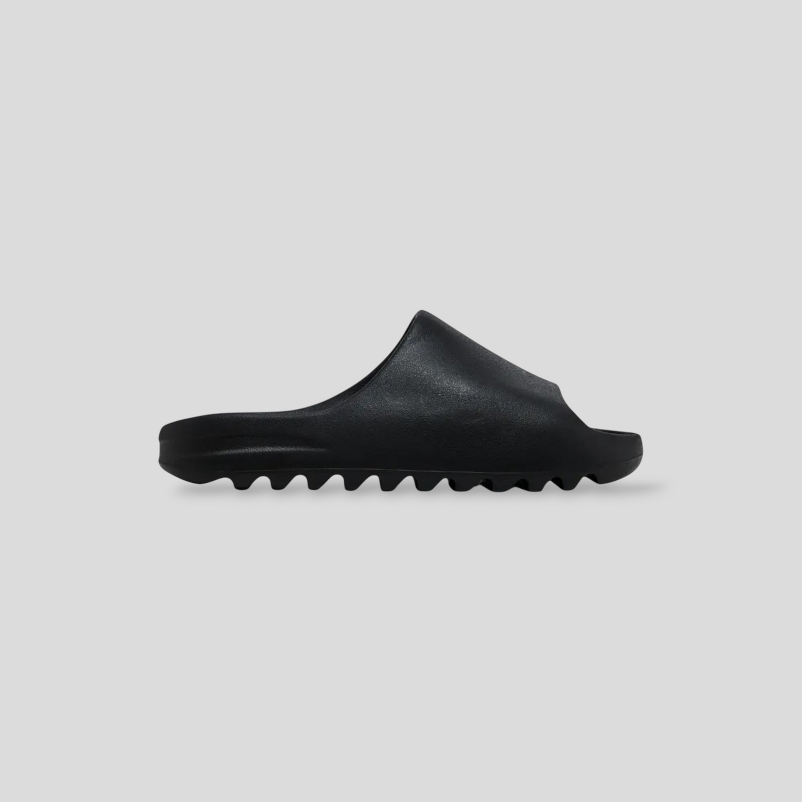CLB XXIII YZY YS-01 black injection-molded EVA foam slide with a minimalist design and deep-grooved traction sole