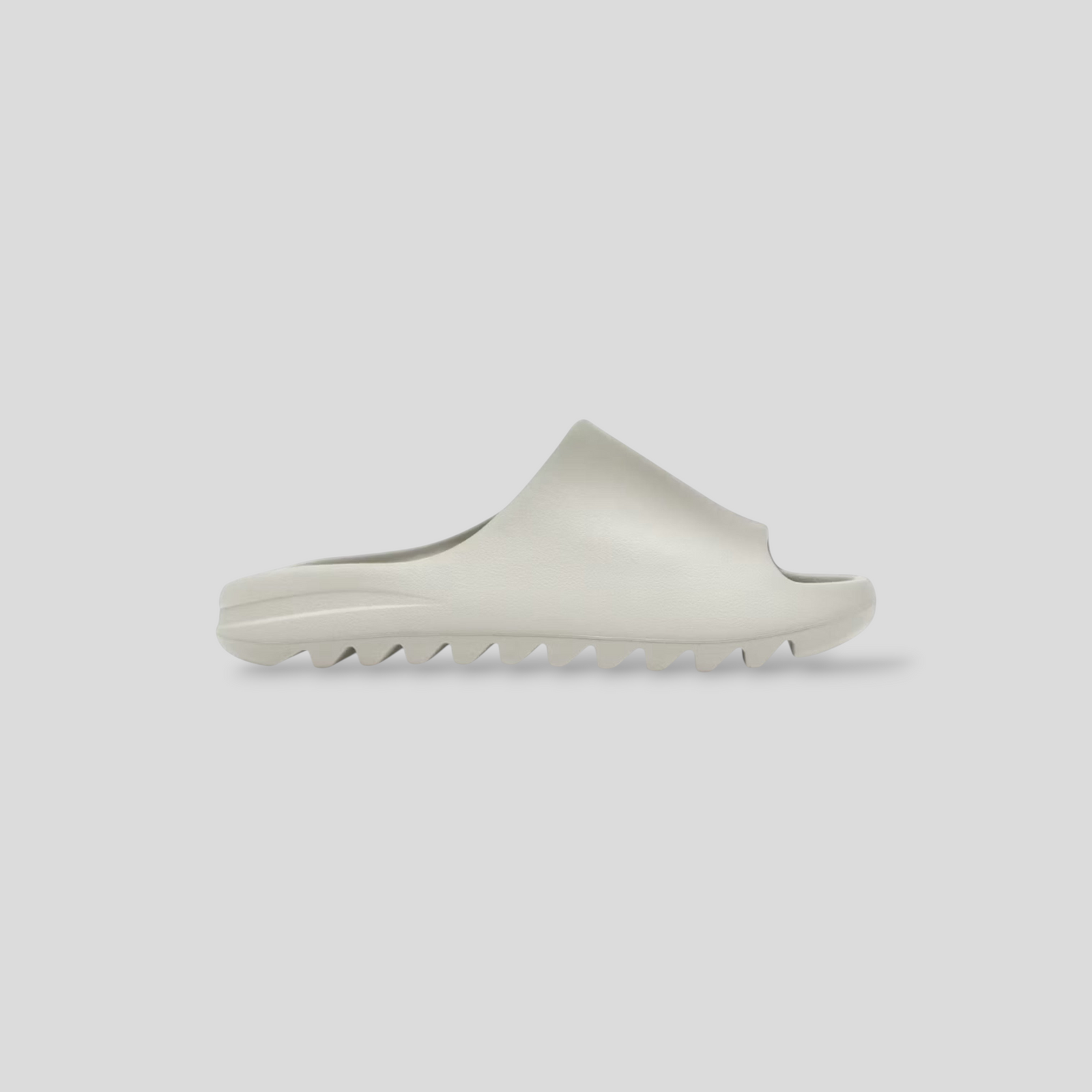 CLB XXIII YZY YS-01 cream molded slide with a minimalist sculptural silhouette and serrated sole