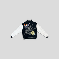 CLB XXIII Louis Vuitton varsity jacket with black wool body, white cowhide sleeves, and back crochet floral graphic.