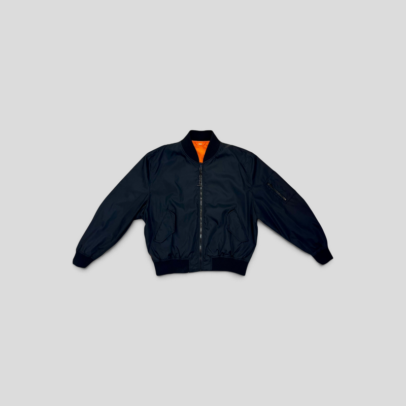 CLB XXIII Louis Vuitton reversible bomber jacket in black polyamide with a vibrant orange lining and zip closure.