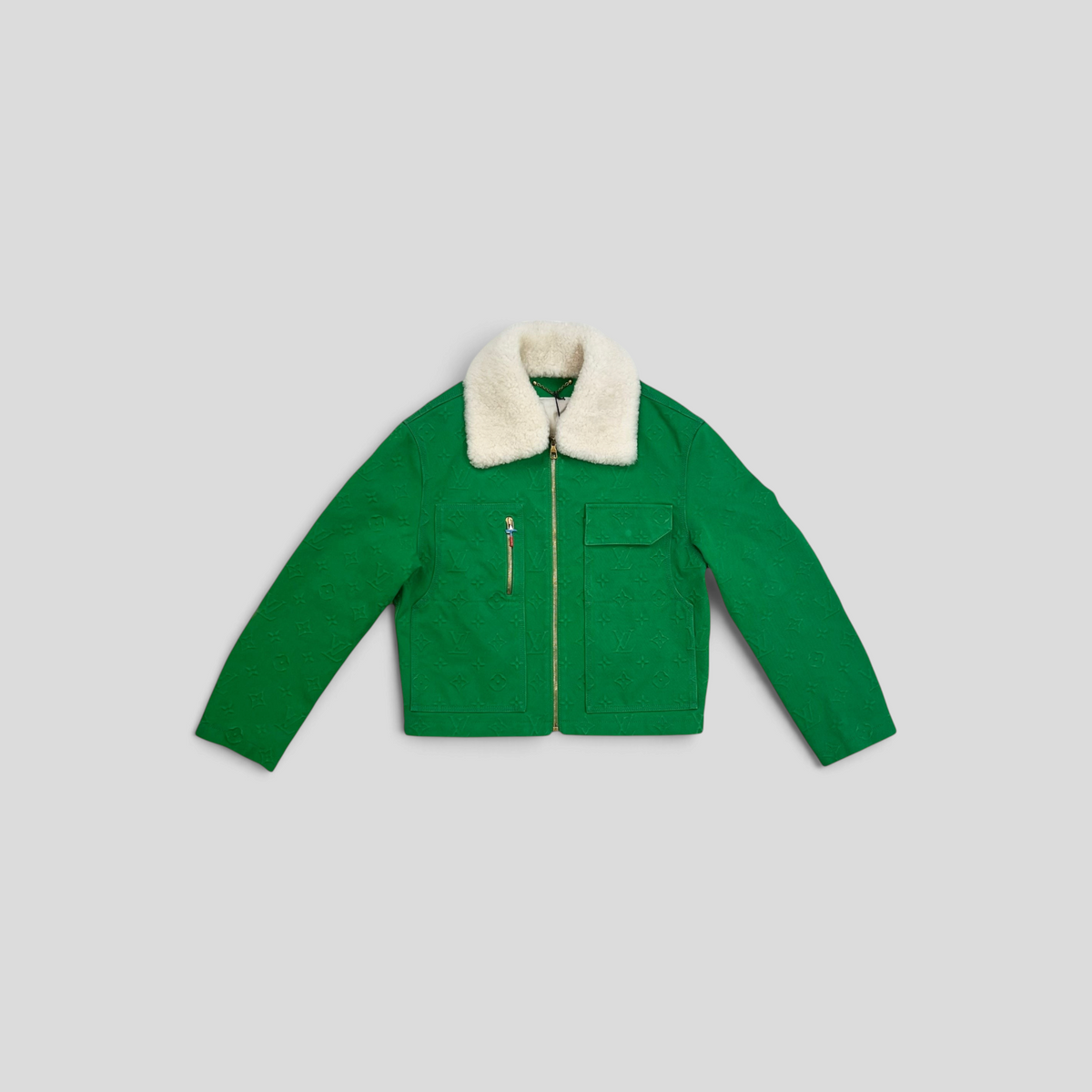 CLB XXIII Louis Vuitton green monogram denim workwear jacket with a white shearling collar and gold zipper details.