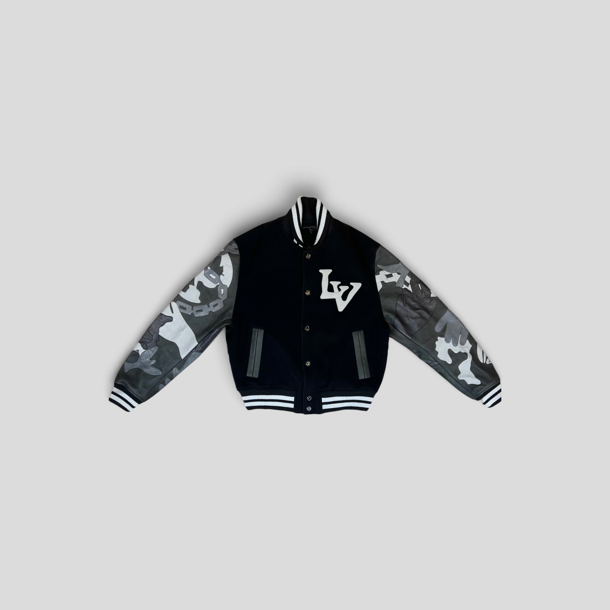 CLB XXIII Louis Vuitton wool varsity jacket with black body, camouflage leather sleeves, and chain link detailing.