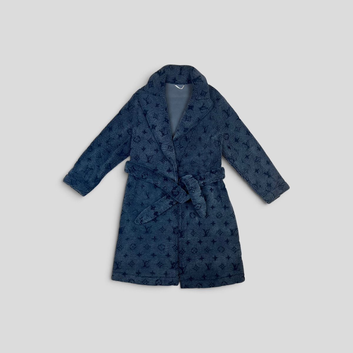 CLB XXIII Louis Vuitton blue monogram shearling overcoat with a belted waist and lapel collar.