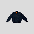 CLB XXIII Louis Vuitton reversible bomber jacket in black polyamide with a bright orange lining and zip closure.