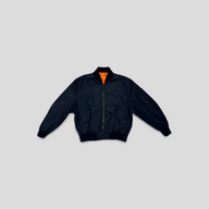 CLB XXIII Louis Vuitton reversible bomber jacket in black polyamide with a bright orange lining and zip closure.