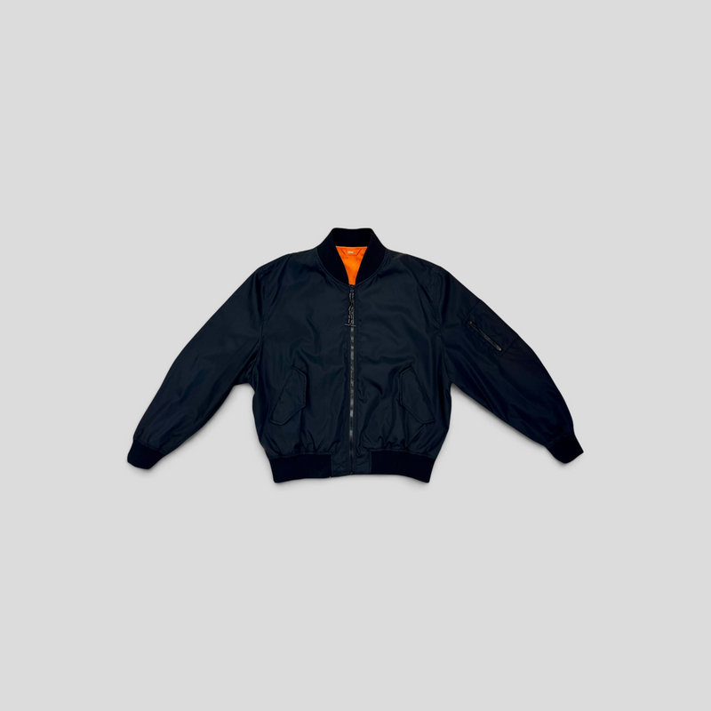CLB XXIII Louis Vuitton reversible bomber jacket in black polyamide with a bright orange lining and zip closure.