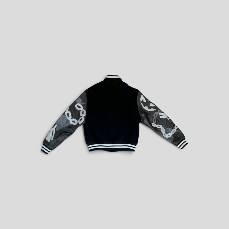 Back view of a CLB XXIII Louis Vuitton wool varsity jacket featuring black body and grey camouflage chain link sleeves.