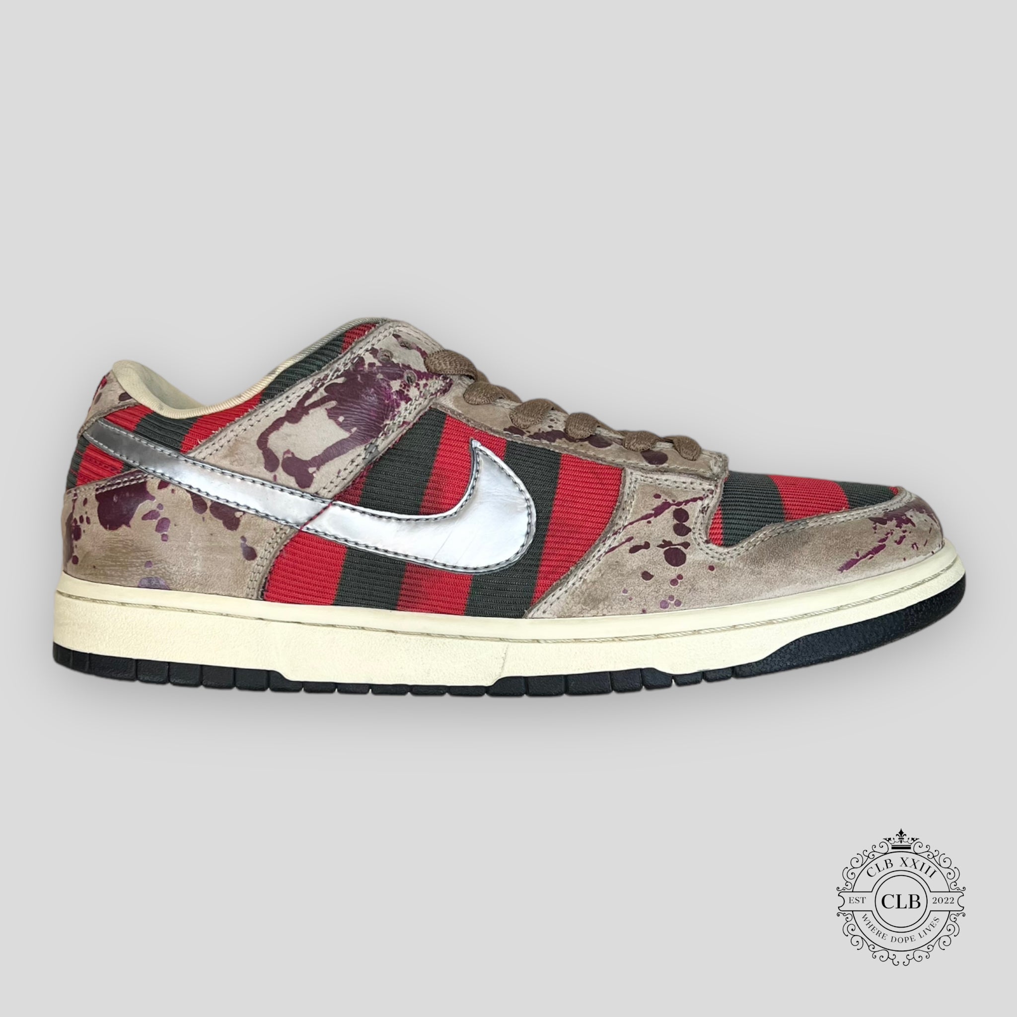 The Nike SB Dunk Low Freddy Krueger is considered one of the rarest sneakers ever produced. Originally inspired by the horror film "A Nightmare on Elm Street," the shoe was cancelled before its official release after licensing concerns. Only a very limited number of pairs escaped into circulation, making it one of the most sought-after Nike SB Dunk releases in history.